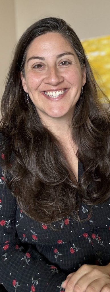 smiling woman with long brown hair